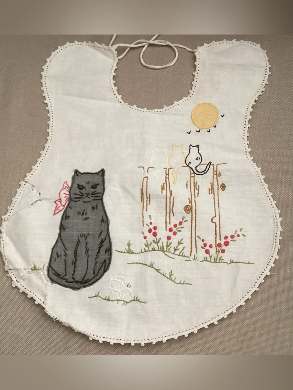 Antique hand-made embroidered linen baby bib featuring a lg. grey cat